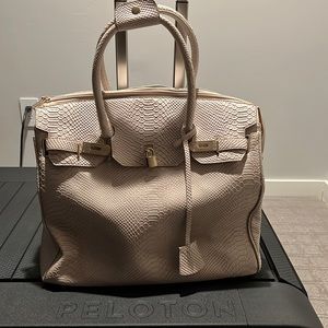 Beautiful KC Jagger Rolling tote bag/weekender from Neiman Marcus.